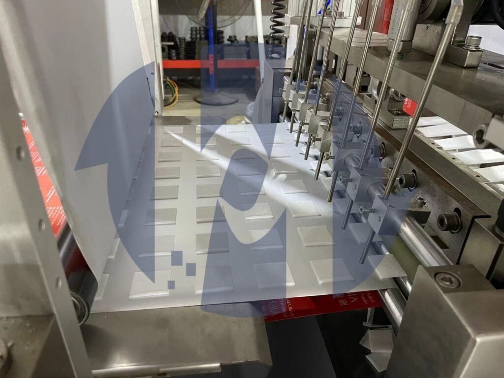 Close-up of the process of folding and evenly adding liquid to spunlace nonwoven fabric